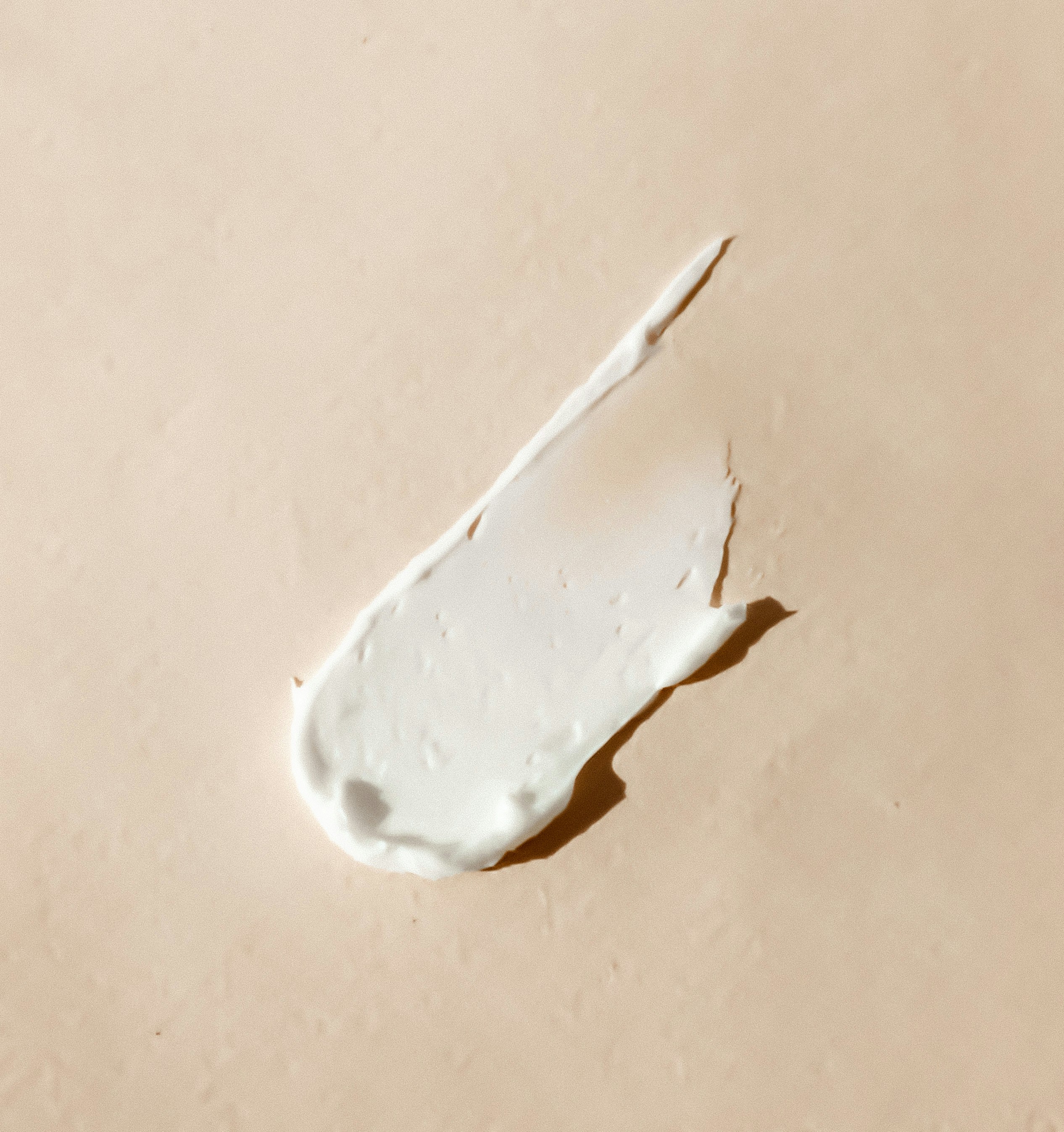 Moisturiser texture on a neutral background